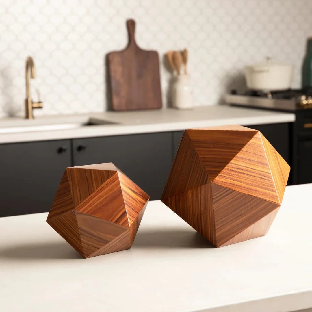 Two geometric wooden urns on a kitchen countertop